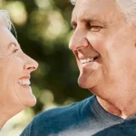 Couple Smiling after refinancing their caravan loan