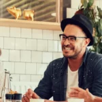 Group of business owners having happy discussion at a cafe