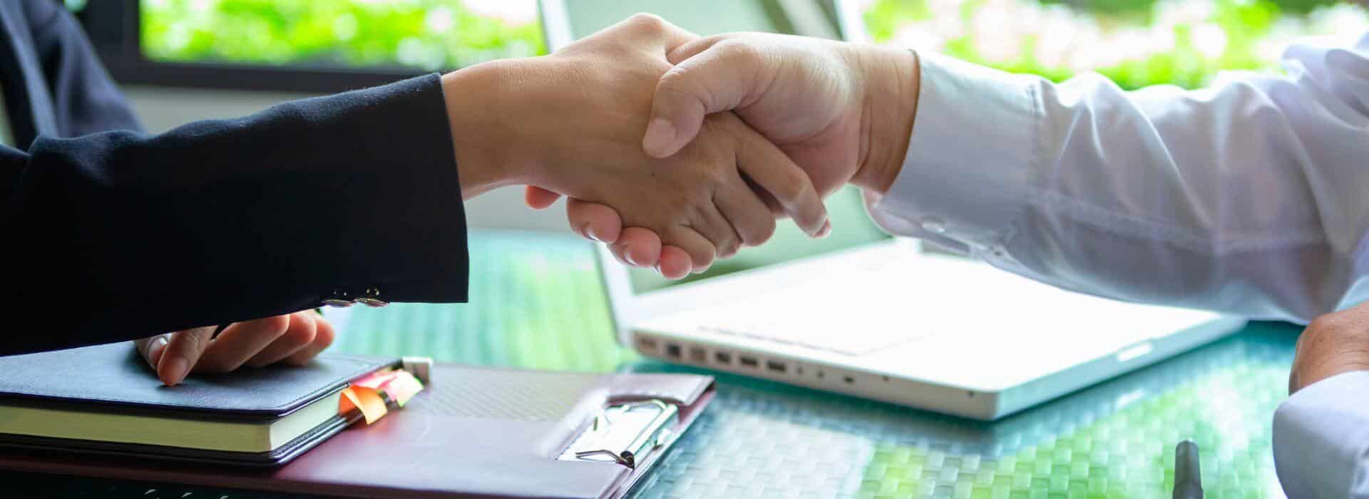 lender and borrower shake hands